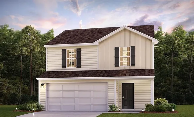 a view of a house with a yard and garage