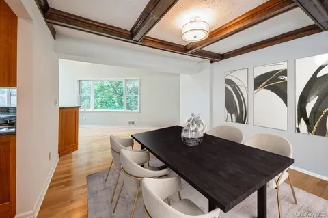 a view of a dining room with furniture and window