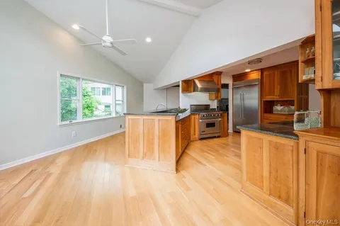 a view of kitchen with furniture and wooden floor
