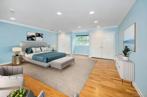 a spacious bedroom with a large bed and a couch