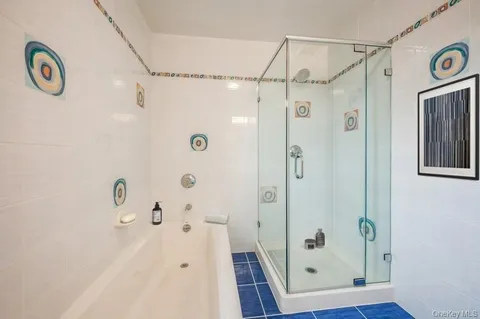 a bathroom with a shower and a sink