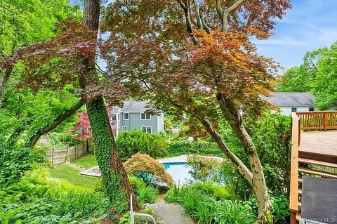 a backyard of a house with lots of green space