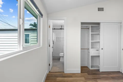 a view of a bathroom with a glass door and a window