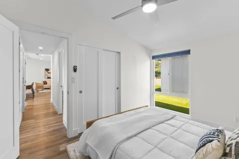 a bedroom with a bed and a couch