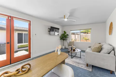 a living room with furniture and a large window