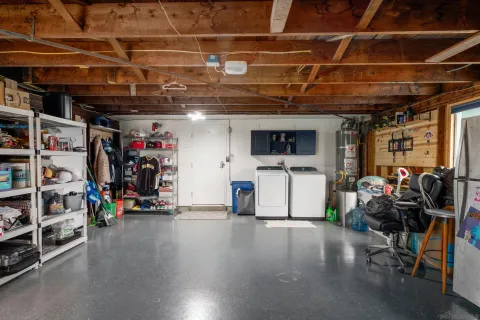 a view of a storage room with furniture fridge and stairs