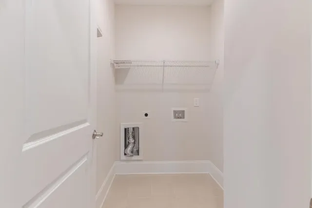 a view of an empty room and wooden floor