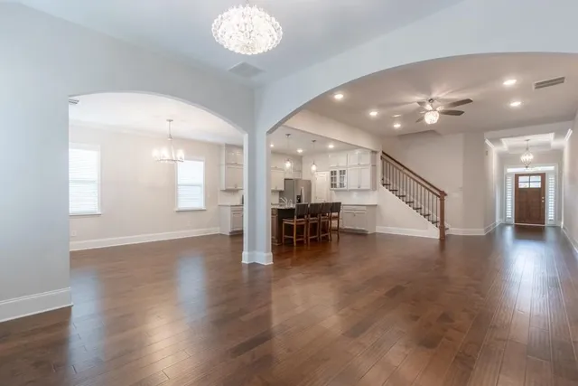 a view of a room with wooden floor