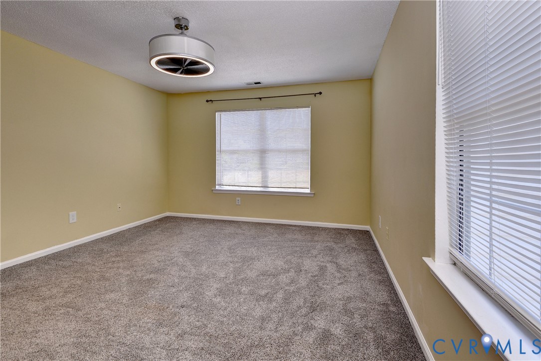 5912 Allegheny Road Williamsburg, VA 23188 - Photo 19 of 38 Large Primary Bedroom with ensuite bathroom and WI