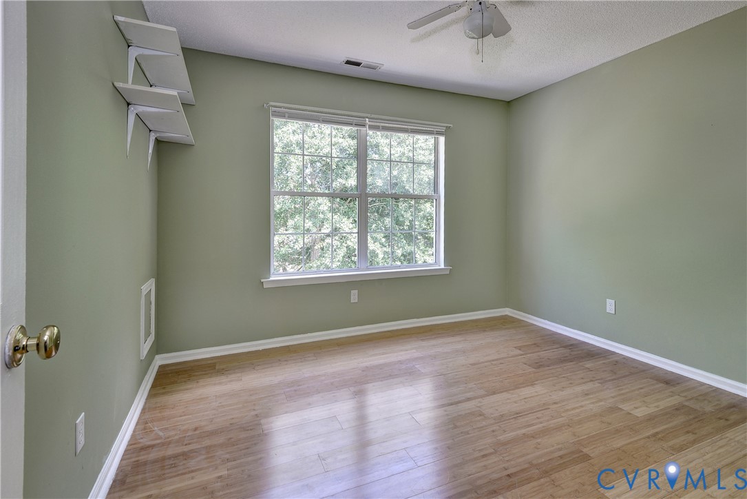 5912 Allegheny Road Williamsburg, VA 23188 - Photo 22 of 38 Bedroom two with bamboo flooring and ceiling fan