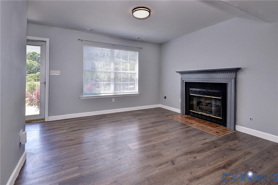 5912 Allegheny Road Williamsburg, VA 23188 - Photo 4 of 38 Large open Living room with LVP, natural gas firep