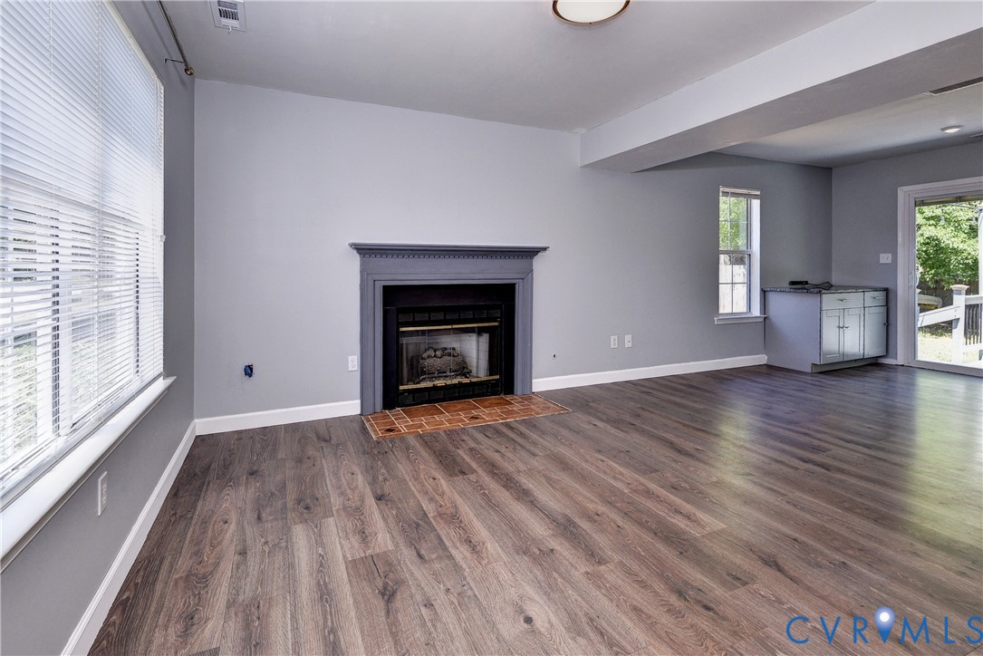 5912 Allegheny Road Williamsburg, VA 23188 - Photo 6 of 38 Large open Living room with LVP, natural gas firep