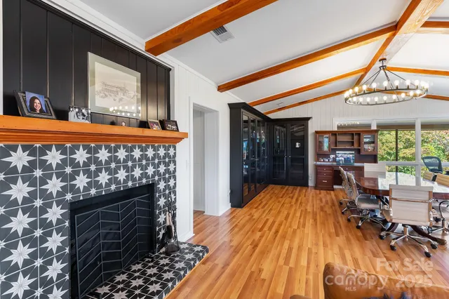 a bed sitting in a room next to a window