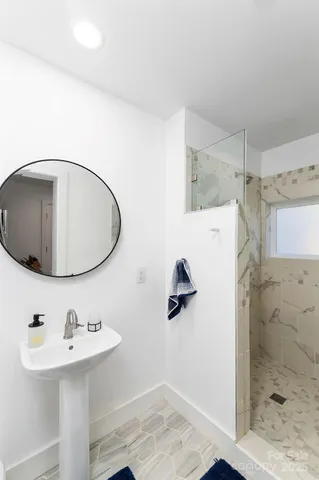 a bathroom with a sink and mirror