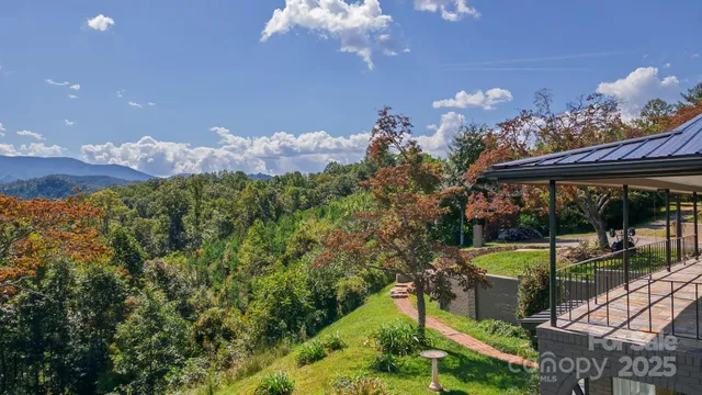 a view of a balcony with an outdoor seating