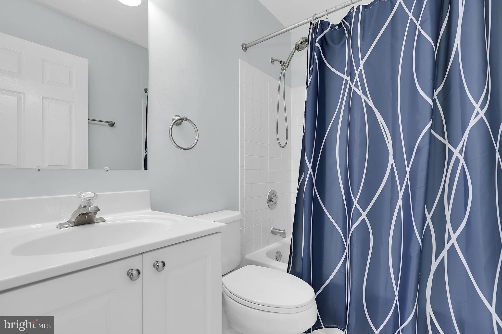 7150 Natures Road Columbia, MD 21046 - Photo 19 of 45 a bathroom with a sink a toilet and shower
