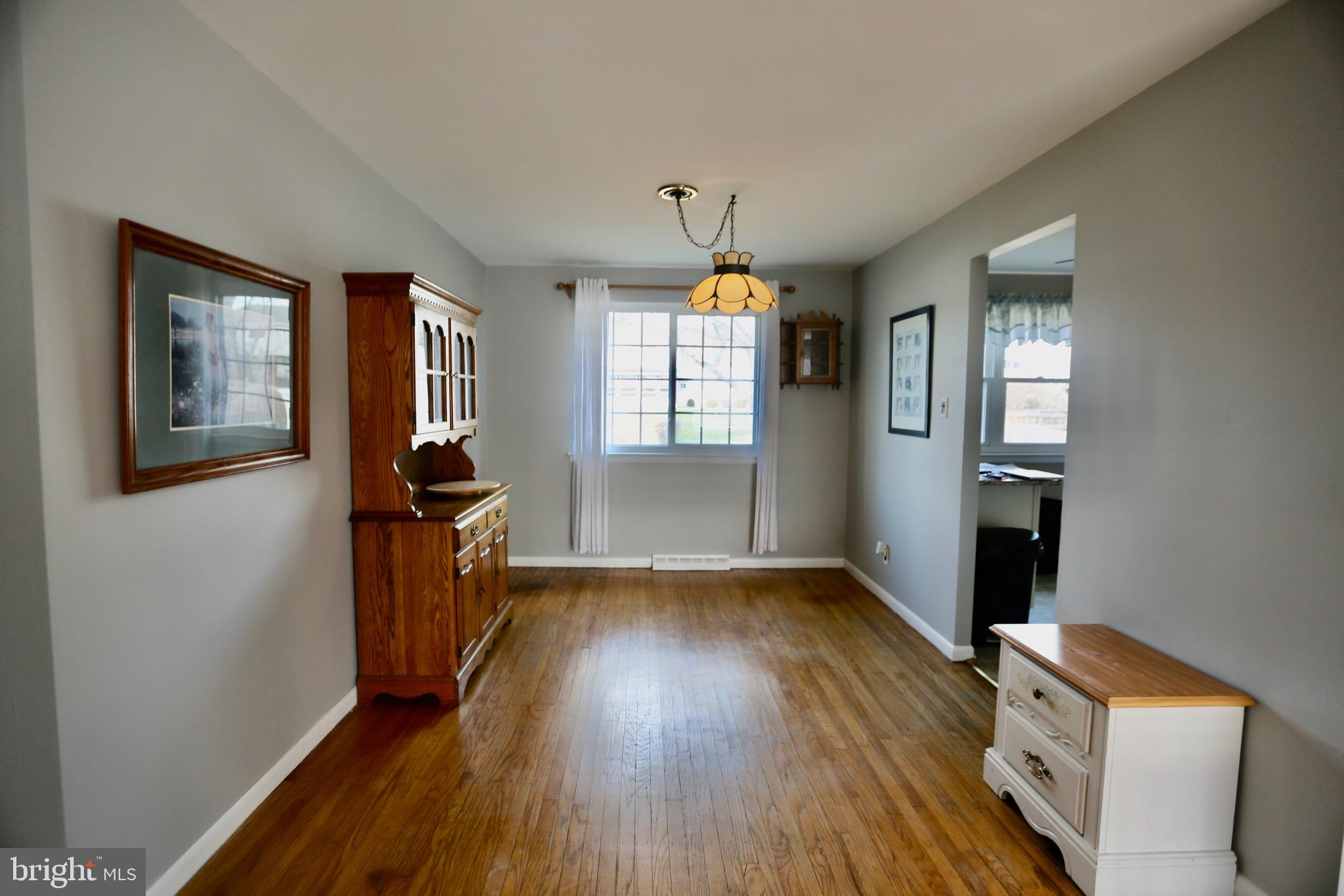 242 Tilford Road Somerdale, NJ 08083 - Photo 7 of 29 wooden floor in an empty room with a window