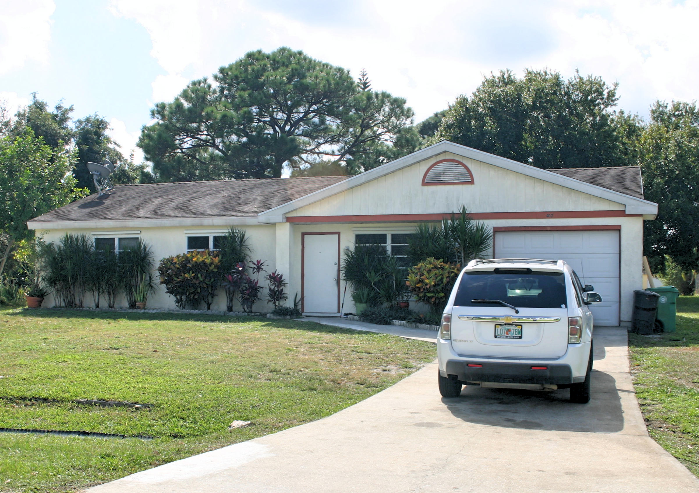 417 Southwest Kentwood Road Port St. Lucie, FL 34953 - Photo 1 of 18 Front of House