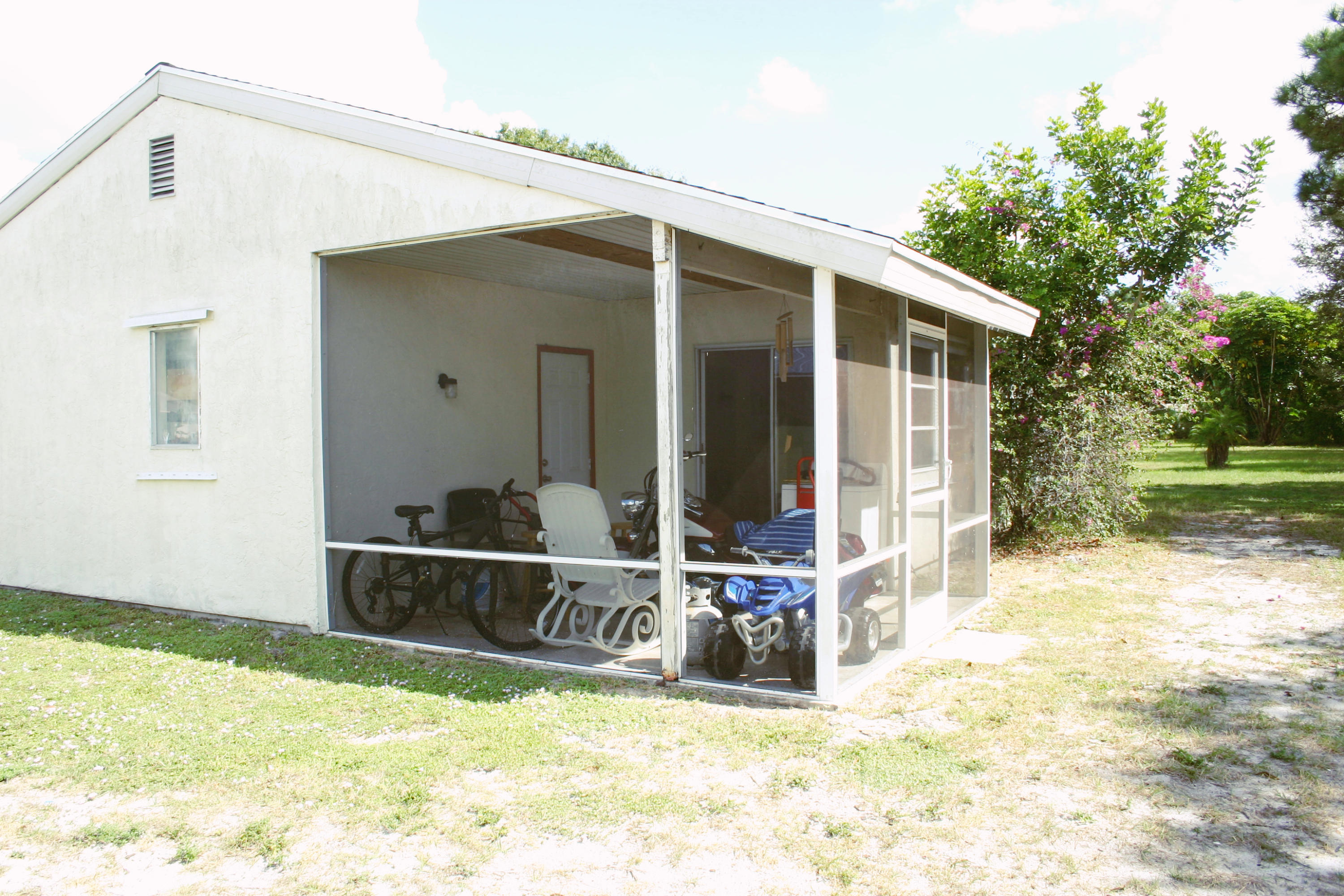 417 Southwest Kentwood Road Port St. Lucie, FL 34953 - Photo 15 of 18 Covered screened porch