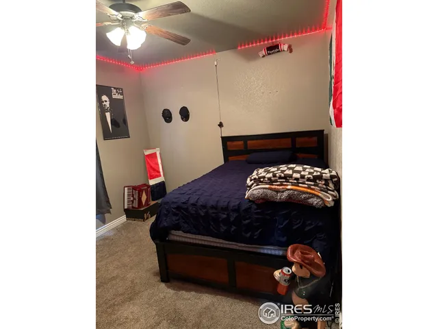 a bed room with a bed and a dresser