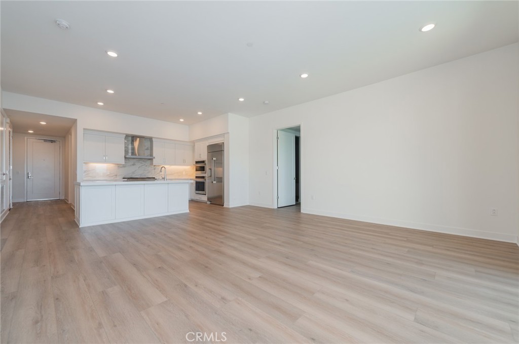 1703 Rivington Irvine, CA 92612 - Photo 16 of 42 a view of a kitchen with a sink and a refrigerator