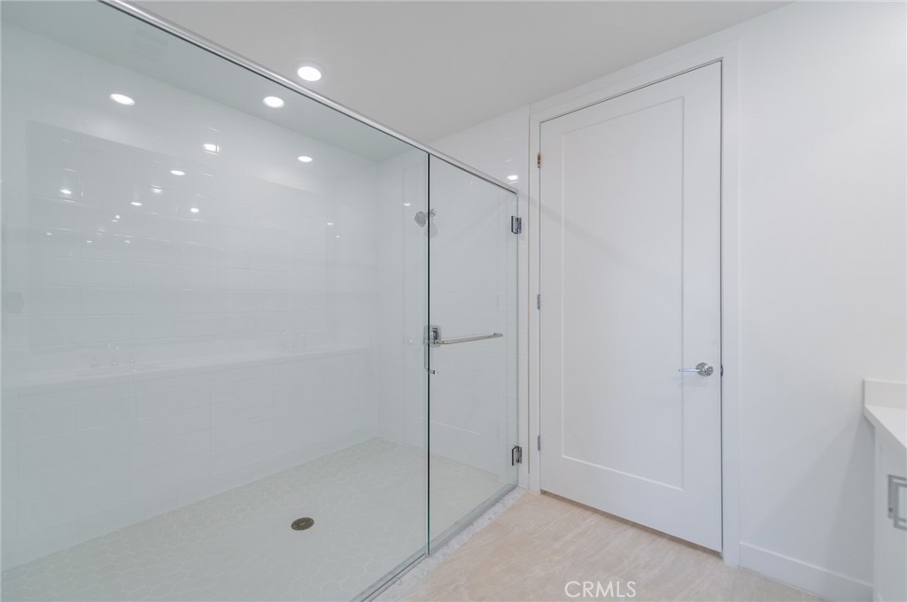 1703 Rivington Irvine, CA 92612 - Photo 23 of 42 a bathroom with a shower and a glass door