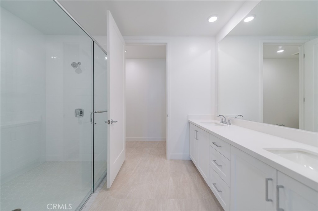1703 Rivington Irvine, CA 92612 - Photo 24 of 42 a bathroom with a double vanity sink and mirror