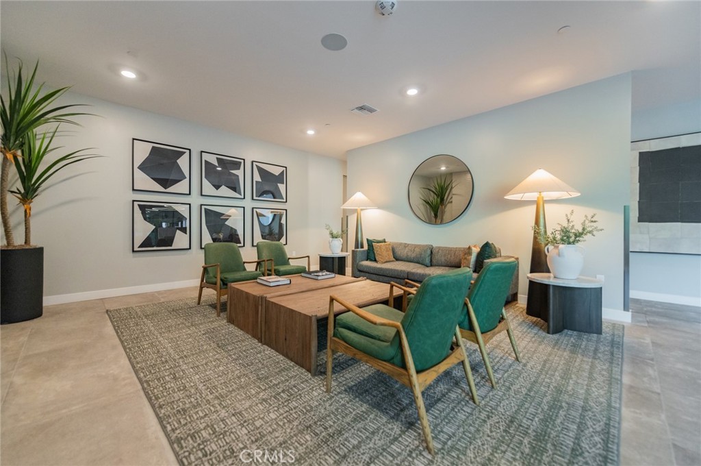 1703 Rivington Irvine, CA 92612 - Photo 31 of 42 a living room with furniture and a large window