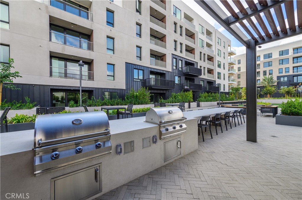 1703 Rivington Irvine, CA 92612 - Photo 35 of 42 a view of a patio with a table and chairs