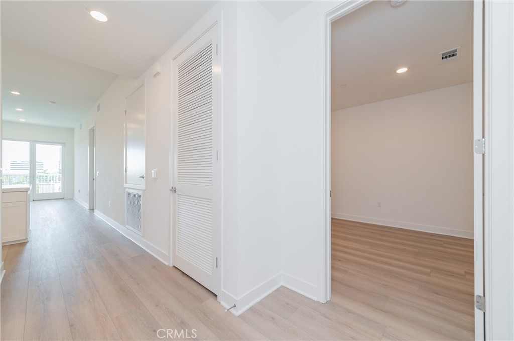 1703 Rivington Irvine, CA 92612 - Photo 4 of 42 a view of hallway with wooden floor