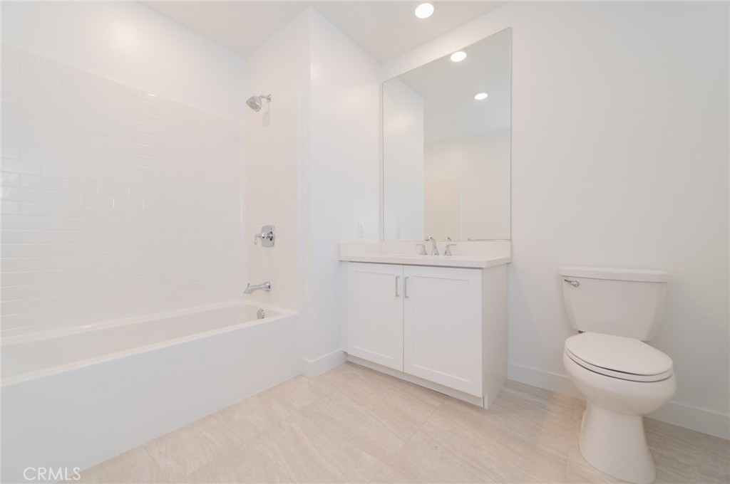 1703 Rivington Irvine, CA 92612 - Photo 6 of 42 a bathroom with a toilet and a tub