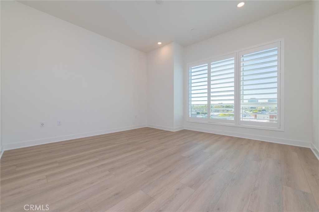 1703 Rivington Irvine, CA 92612 - Photo 10 of 42 wooden floor in an empty room with a window