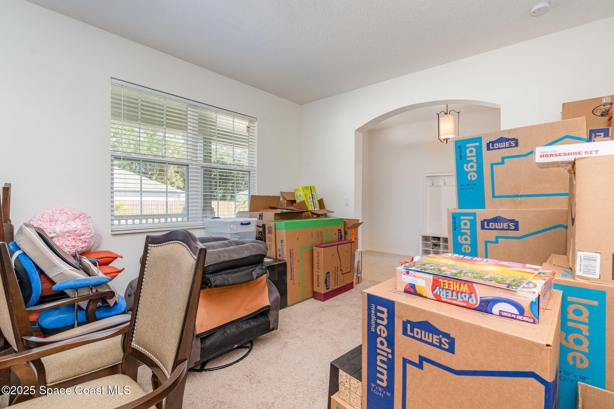 352 Gordon Road Northwest Palm Bay, FL 32907 - Photo 15 of 71 a kids bedroom with a bed and a window