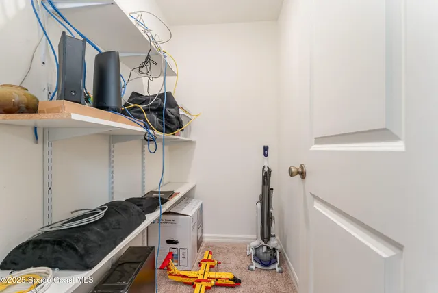 a bathroom with a granite countertop sink a large mirror and shower