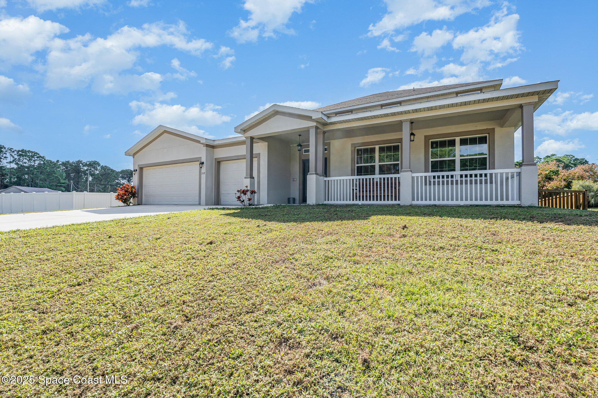 352 Gordon Road Northwest Palm Bay, FL 32907 - Photo 3 of 71 a view of a house with a yard