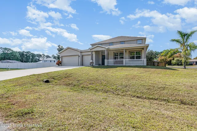 a kitchen with stainless steel appliances kitchen island granite countertop a refrigerator and cabinets