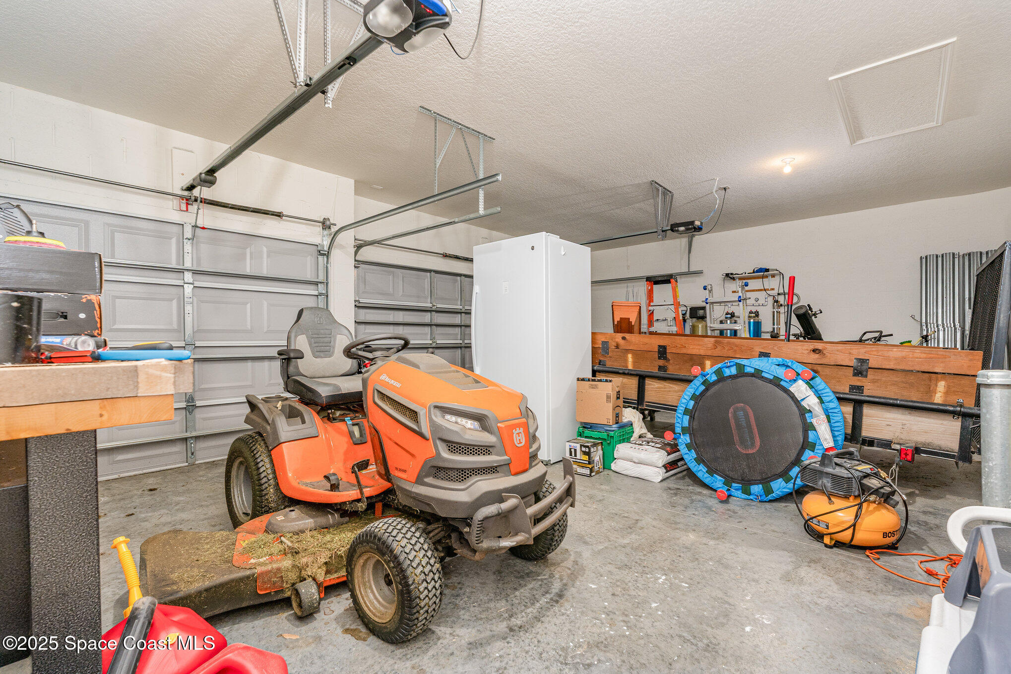 352 Gordon Road Northwest Palm Bay, FL 32907 - Photo 47 of 71 a utility room with furniture and a garage