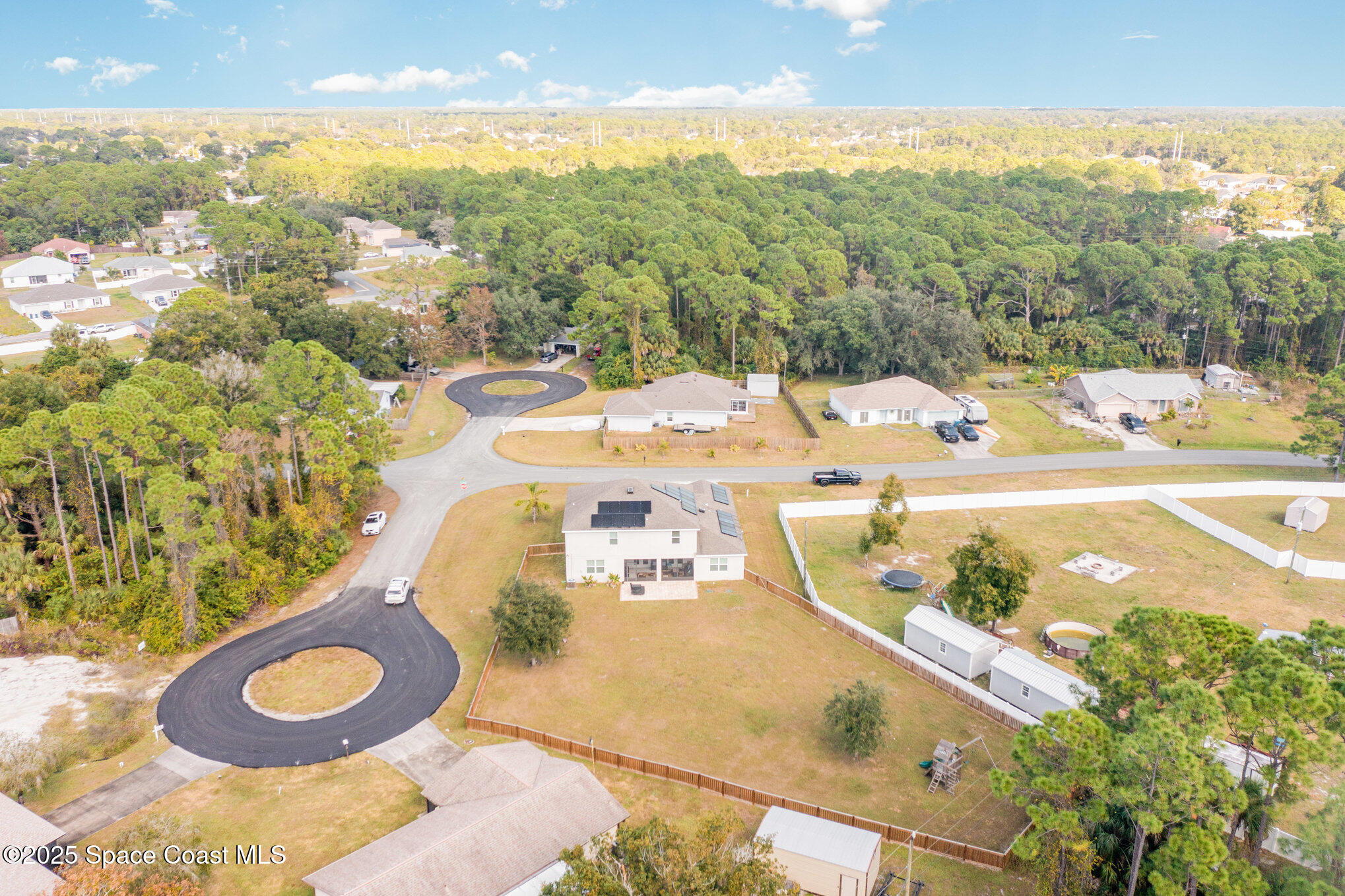 352 Gordon Road Northwest Palm Bay, FL 32907 - Photo 57 of 71 a view of a swimming pool with a patio