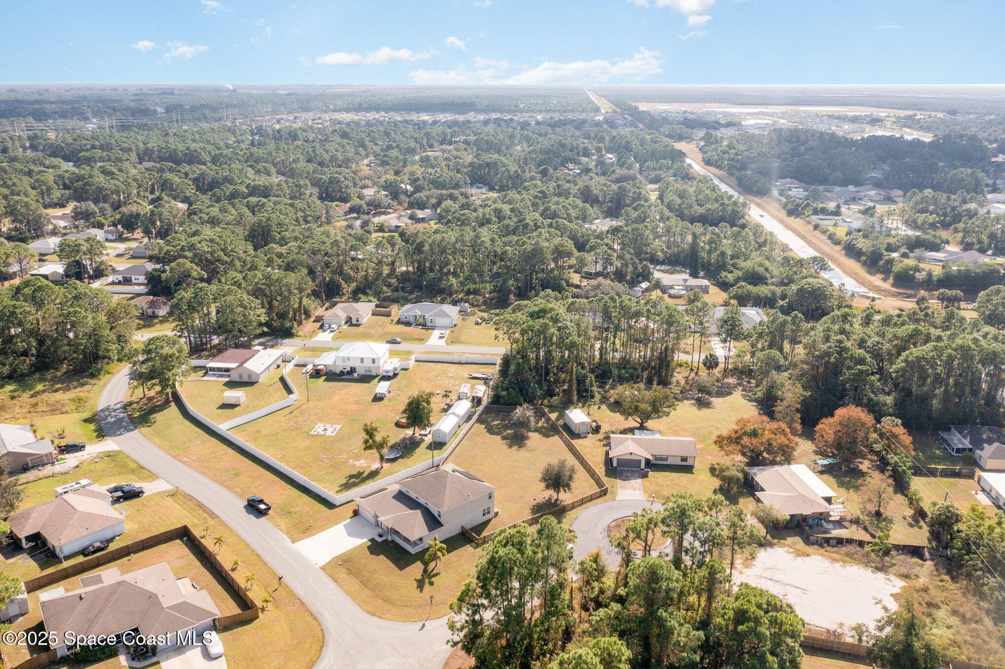352 Gordon Road Northwest Palm Bay, FL 32907 - Photo 64 of 71 an aerial view of residential building with parking space