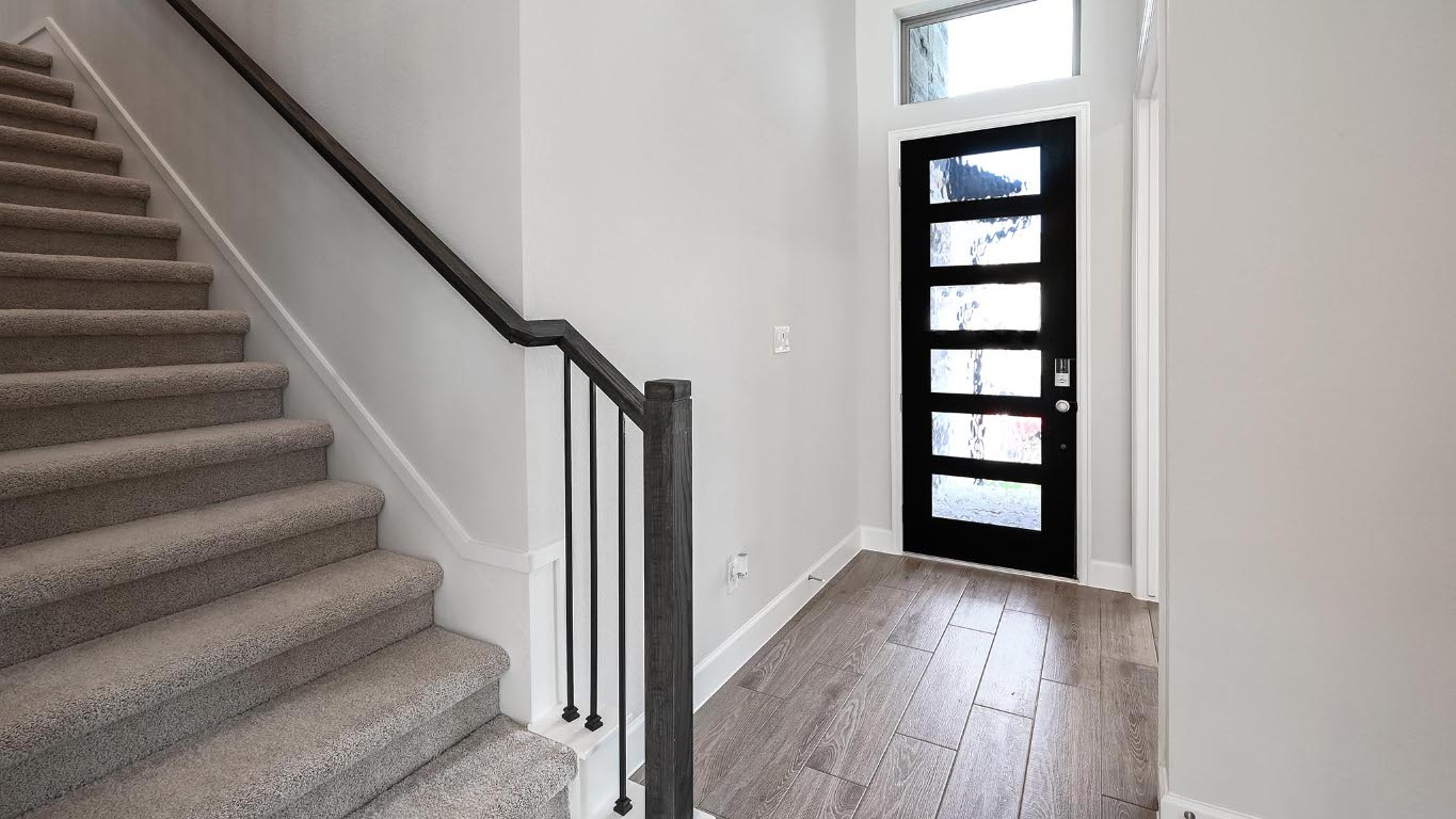 285 Prickly Poppy Loop Kyle, TX 78640 - Photo 14 of 40 Entrance foyer featuring stairway and light wood-style flooring