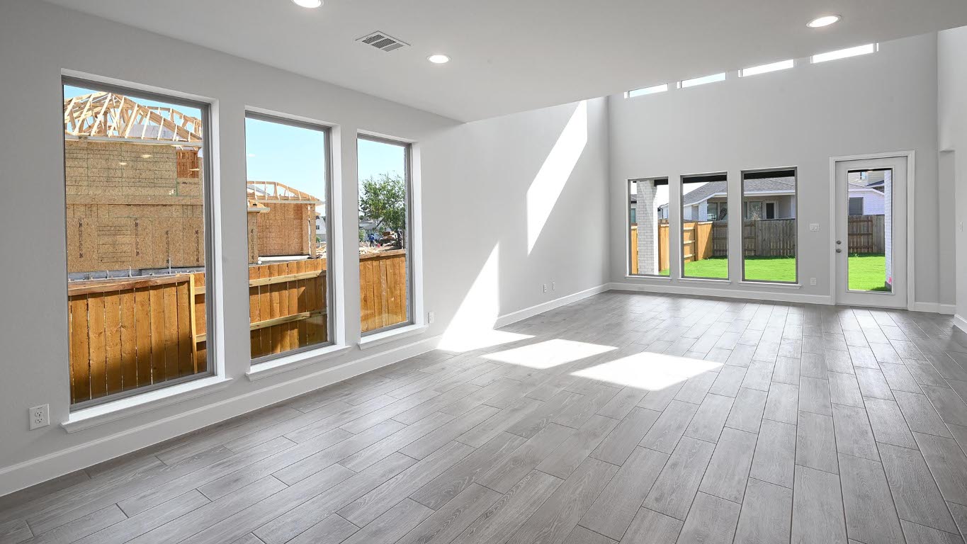 285 Prickly Poppy Loop Kyle, TX 78640 - Photo 9 of 40 Spare room featuring recessed lighting and wood finished floors