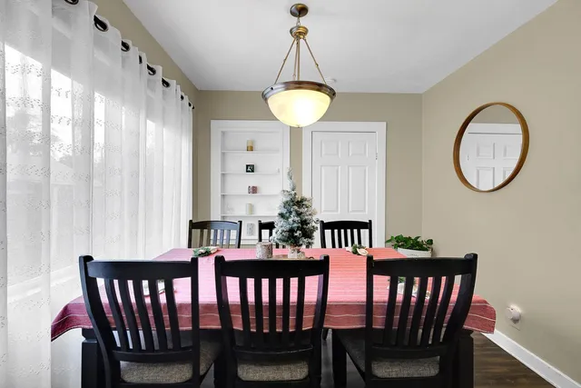 a bathroom with a sink mirror vanity and toilet