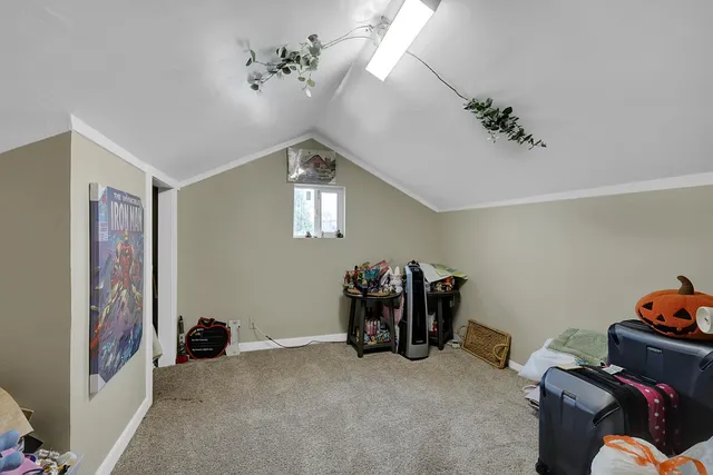 a backyard of a house with barbeque oven and outdoor seating