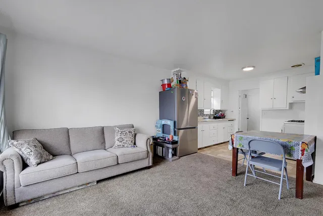 a bedroom with a bed and cabinets