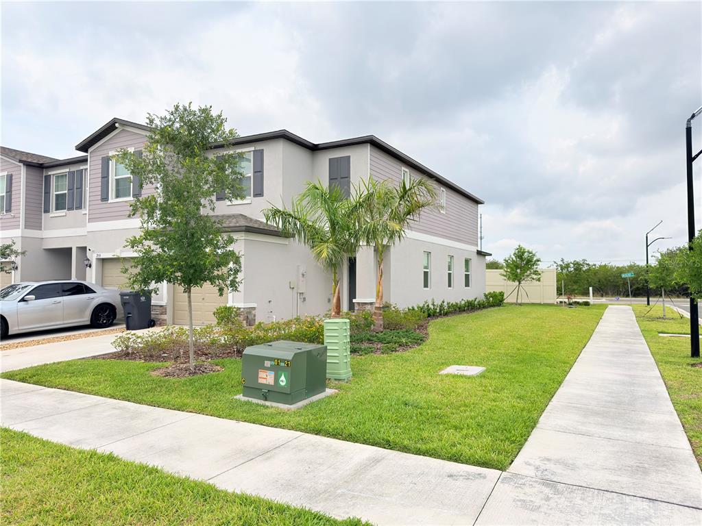 253 Tulip Banded Way Ruskin, FL 33570 - Photo 1 of 20 a front view of house with yard and green space