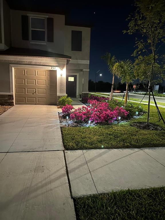 253 Tulip Banded Way Ruskin, FL 33570 - Photo 2 of 20 a front view of a house with a yard