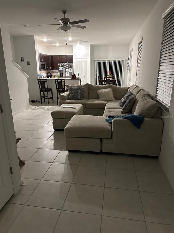 253 Tulip Banded Way Ruskin, FL 33570 - Photo 5 of 20 a living room with furniture and a chandelier