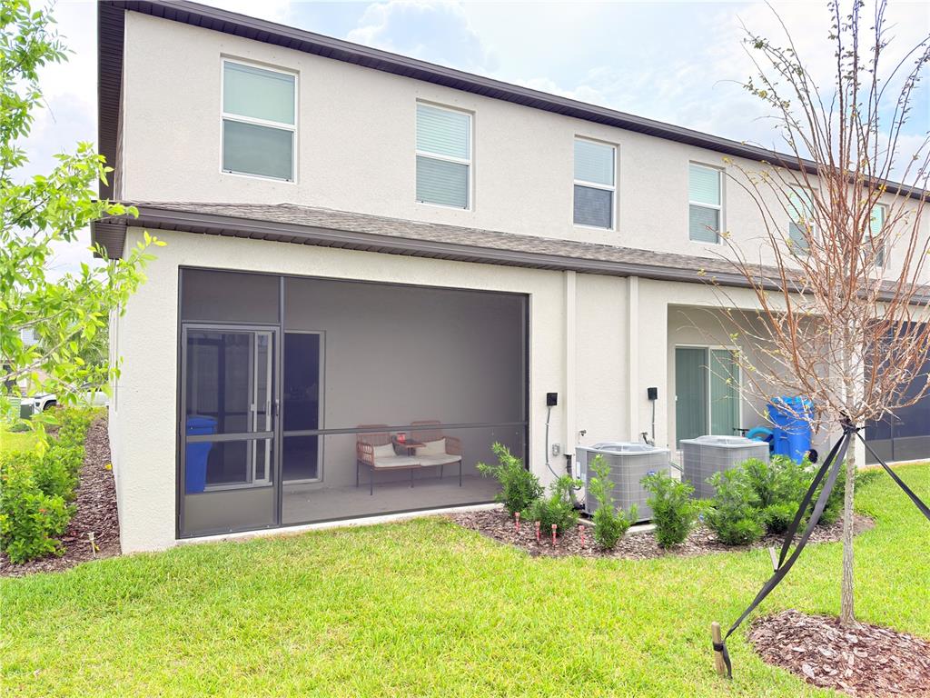 253 Tulip Banded Way Ruskin, FL 33570 - Photo 9 of 20 front view of a house with a yard