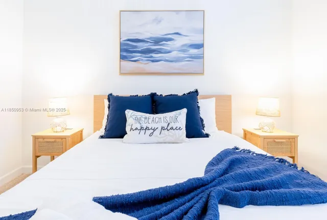 a bed sitting in a bedroom and a wooden floor