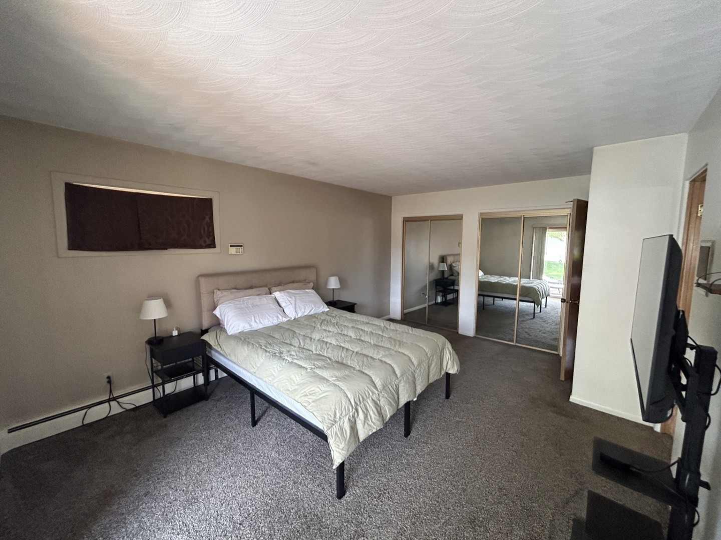 900 Read Street Lockport, IL 60441 - Photo 14 of 23 a bedroom with a bed tv and a mirror